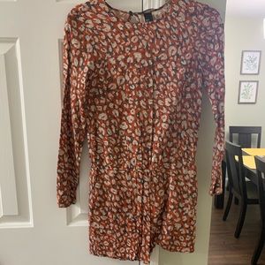 Red and white patterned long sleeve romper